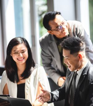 Chinese Asian Business Discussion, Business partners are discussing market strategies
